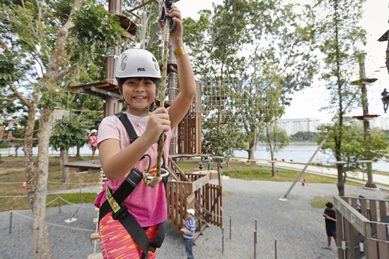 child trying obstacle course at Forest Adventures