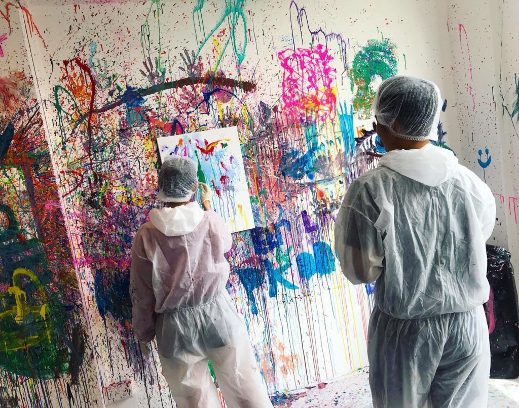 two participant trying splat painting